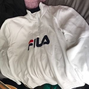 White quarter zip FILA sweater.